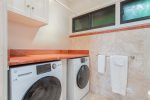 Guests will appreciate the convenience of a high-end washer and dryer, along with a closet that provides ample storage space
